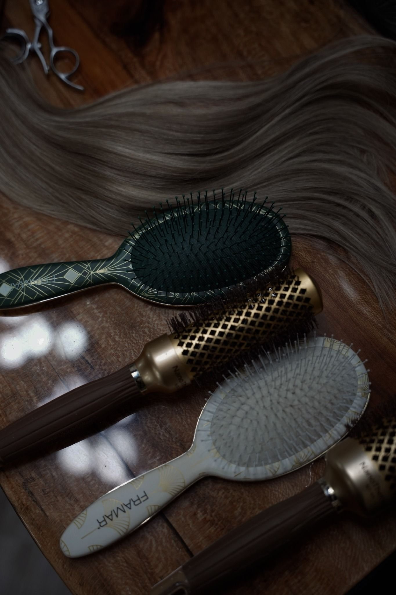 Hair extension brushes and extension hair used for easy at-home extension care