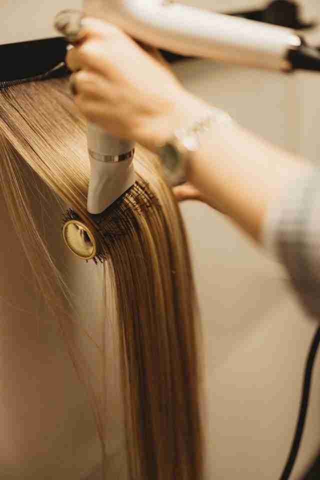Hand-tied extensions being styled